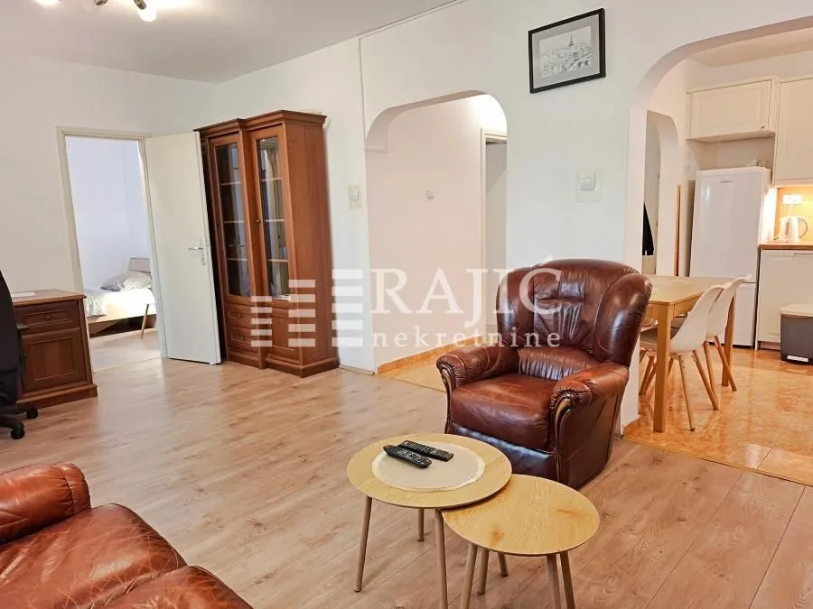 Spacious living room connected to the dining area and kitchen.