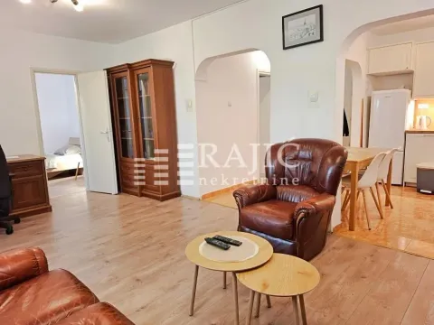 Spacious living room connected to the dining area and kitchen. - image 2