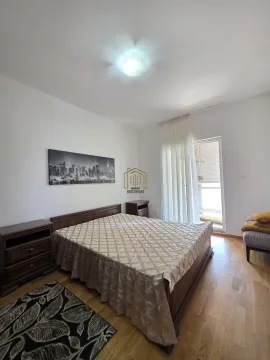 Spacious bedroom with a double bed, bedside table, and access to the terrace. - image 9