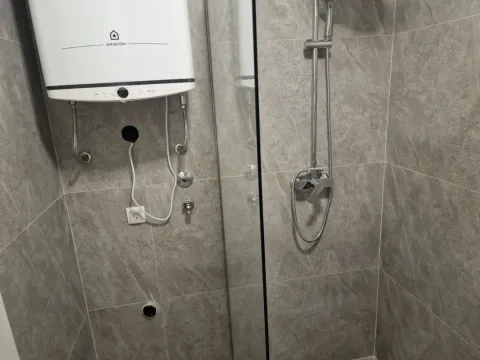 Modern tiles and shower cabin in the bathroom. - image 17