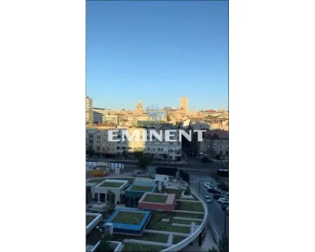 View from the window of the cityscape and surrounding buildings. - image 15