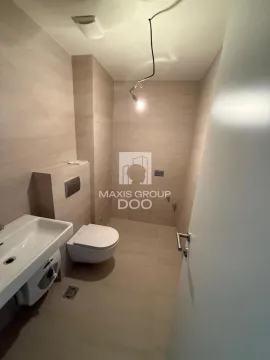 Small bathroom with sanitary ware and beige tiles. - image 10