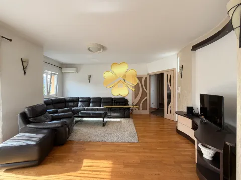 Spacious living room with a sofa set and TV unit. - image 3