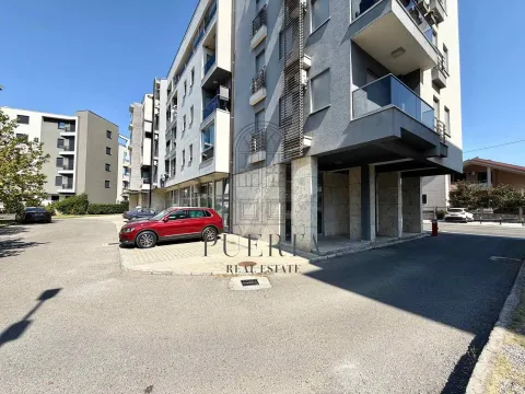 Exterior of a residential building with parking in front of the entrance. - image 15
