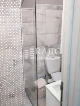 View of the bathroom with a shower cabin and sanitary ware. - image 9