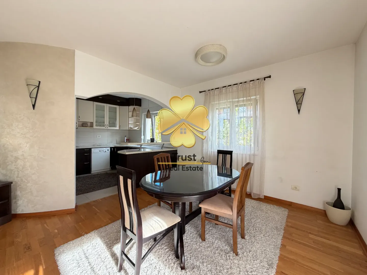 Dining area with a table and chairs, overlooking the kitchen.