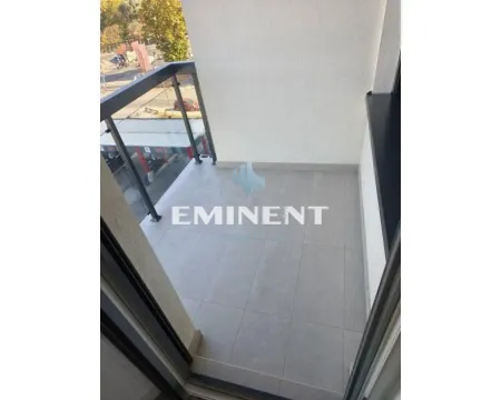 View of an unfurnished balcony with a glass railing. - image 2