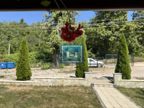 View from the terrace towards the landscaped yard and greenery. - image 6