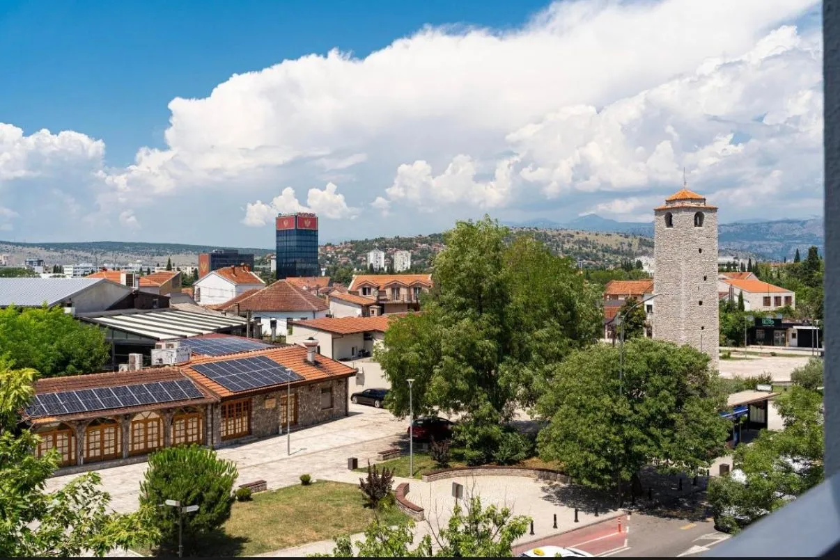 View from the terrace overlooking the city square and surrounding buildings.