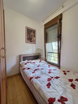 Small bedroom with a bed and a window overlooking the outside. - image 5