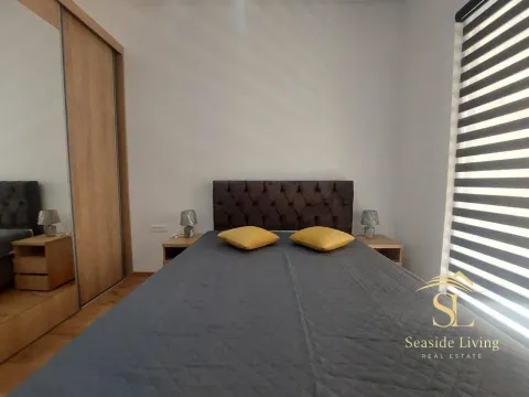 Furnished bedroom with a double bed and wardrobe. - image 12