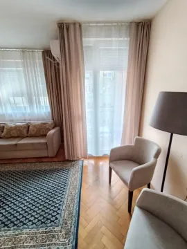 Living room with a sofa, armchairs, and access to the terrace. - image 7