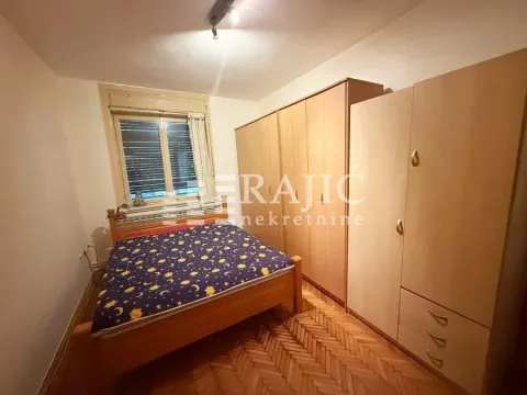 Furnished bedroom with a double bed and wardrobe. - image 8