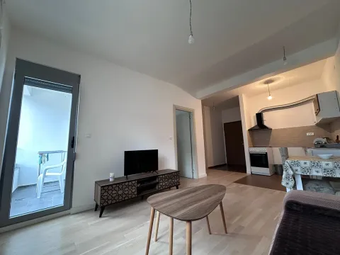 Living room connected to the dining area and kitchen. - image 2