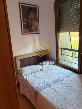 Small bedroom with a double bed and a window. - image 4