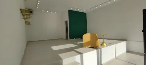 Spacious bright room with a raised platform and a yellow armchair. - image 2