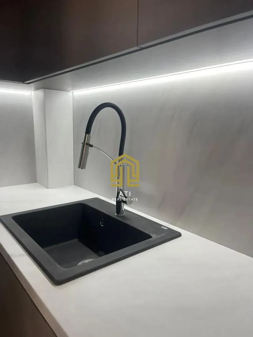 Close-up of the sink and countertop in a modern kitchen.