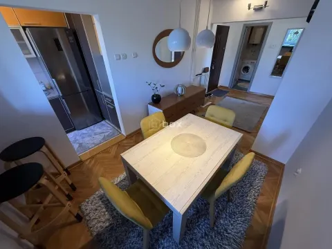 Dining area connected to the kitchen and hallway in the apartment. - image 7