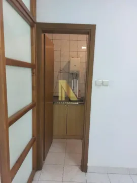 View from the hallway into a small kitchen. - image 5