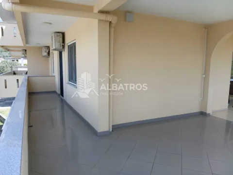 Spacious covered terrace with ceramic tile flooring. - image 16
