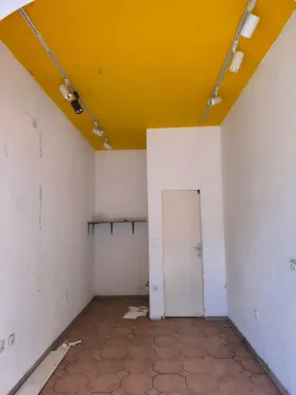 Empty room with a yellow ceiling and lighting fixtures. - image 3
