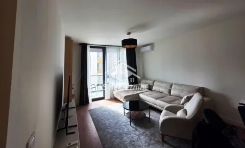 Living room with a sofa, armchair, and access to the terrace. - image 2