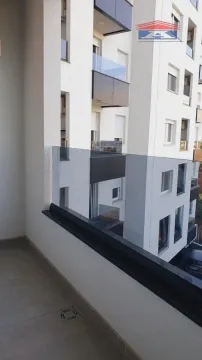 View from the balcony overlooking surrounding buildings and the street. - image 13
