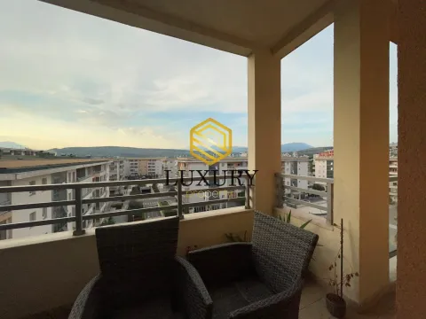 Covered terrace with seating furniture and a view of the city neighborhood. - image 13