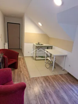 Small kitchen with a sink and a dining table in the attic. - image 3