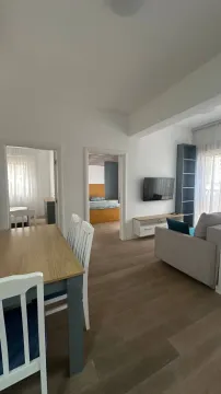 Living room with dining area and a view of the apartment interior. - image 5