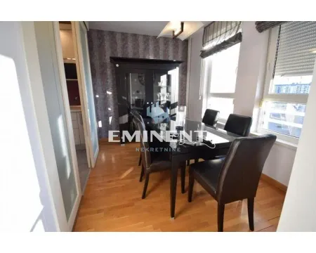 Dining room with a dining table, chairs, and a dark cabinet. - image 5