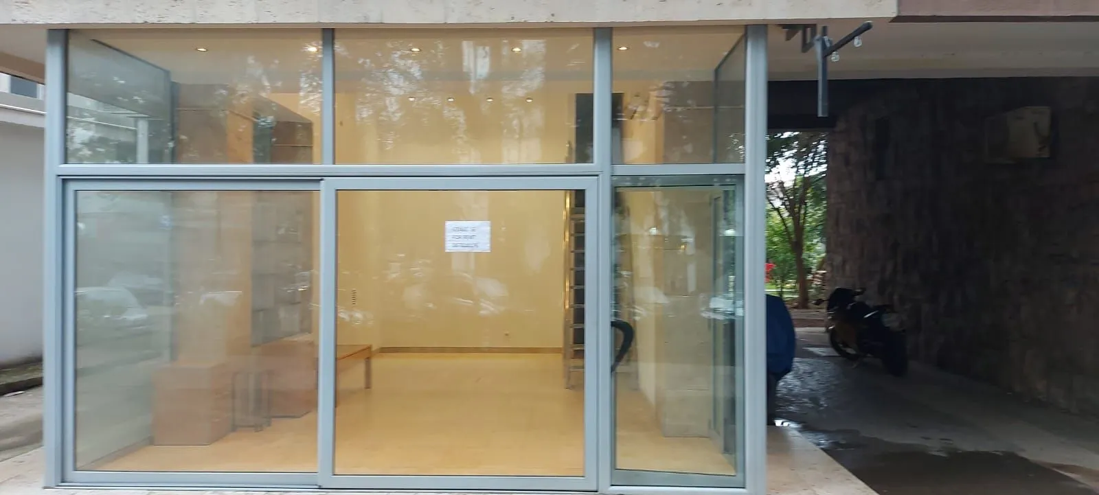 Exterior of a commercial space with a large glass storefront.