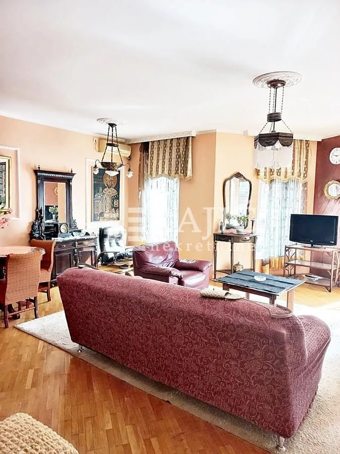 Spacious living room with a sofa set and dining table.