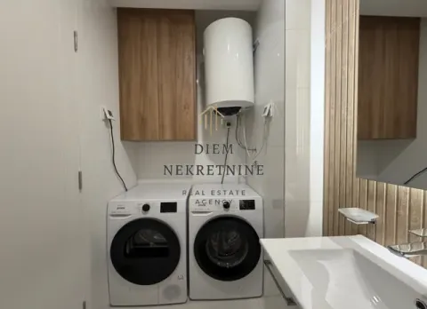 Bathroom with a washing machine, dryer and water heater. - image 12