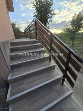 External stairs with a wooden railing and ceramic tiles. - image 11