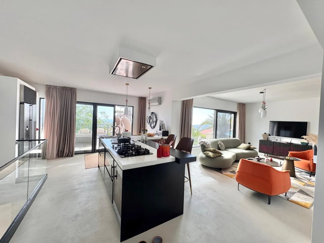 Spacious open-plan area with a kitchen and living room.