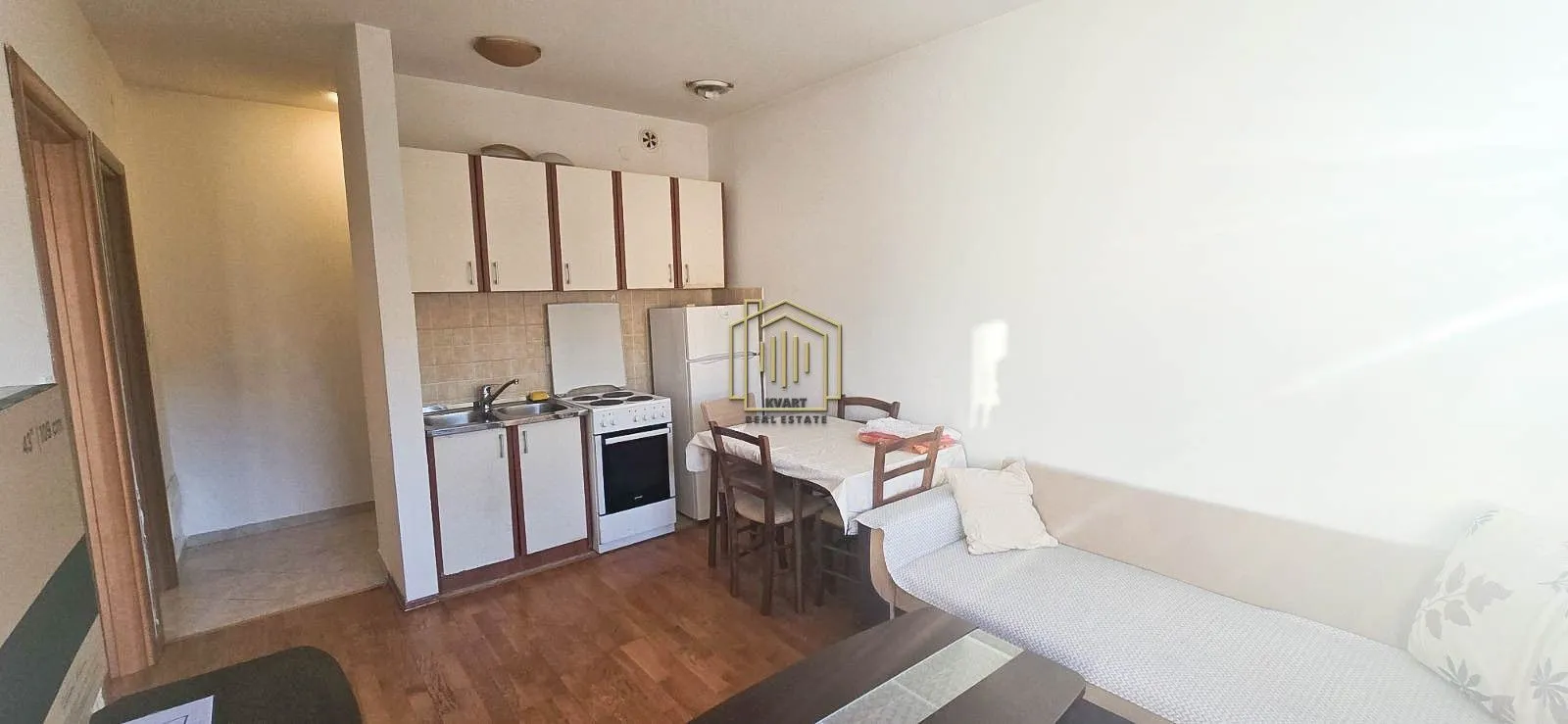 Small kitchen combined with a dining area and living room.