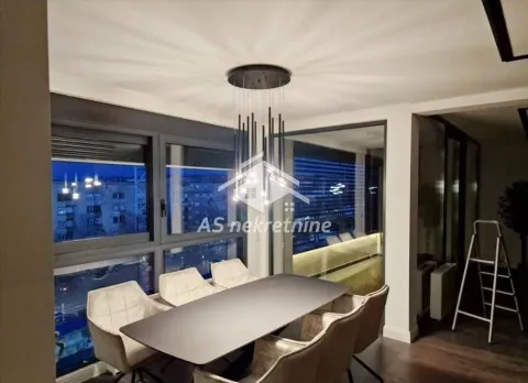 Dining area with a modern table, chairs, and decorative chandelier. - image 15