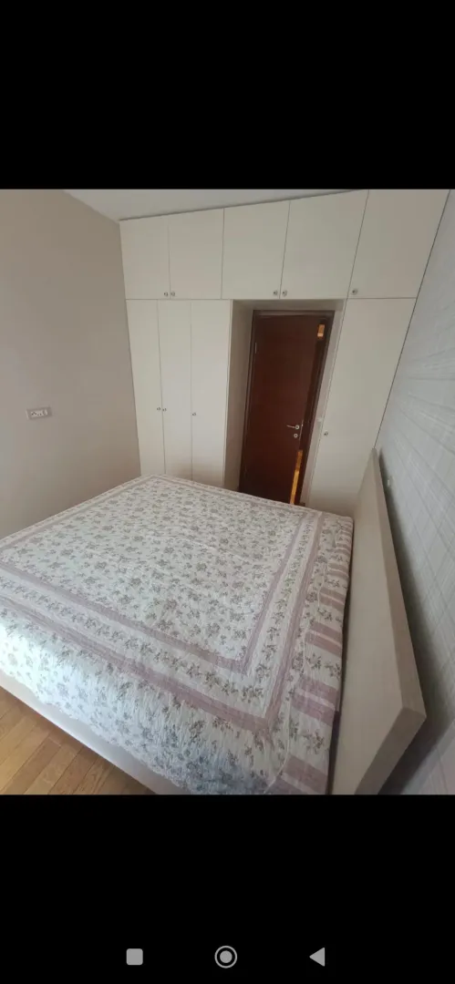 Bedroom with a double bed and built-in wardrobe.