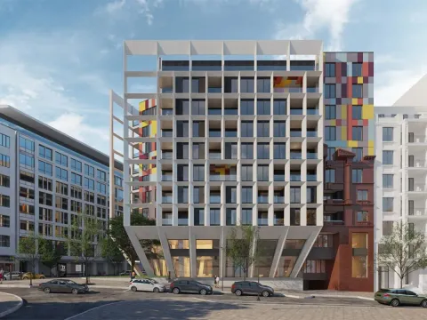 Pogled na spoljašnjost moderne stambene zgrade sa jedinstvenom arhitekturom i šarenim detaljima. - image 3