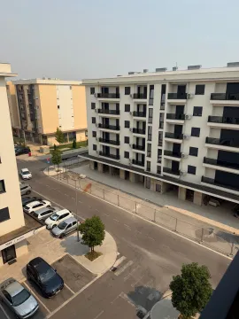 View from the terrace of residential buildings and a street with parking. - image 13