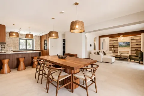 Open-plan living room with a dining area and kitchen in a modern style. - image 14