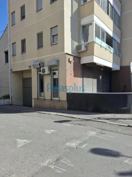 View of the exterior of the residential building with the street in the foreground. - image 13