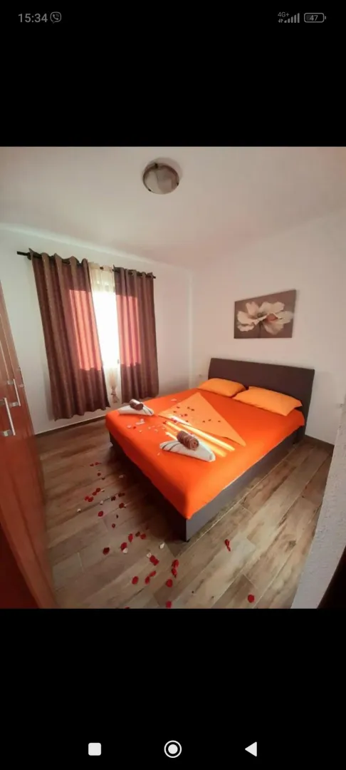 Furnished bedroom with a double bed.