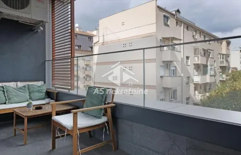 Furnished terrace with seating furniture and glass railing. - image 16