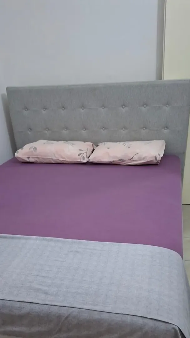 Furnished bedroom with a double bed.
