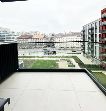 Modern tiled balcony with glass railing and city view. - image 12
