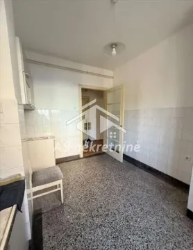 Smaller kitchen with tiled walls and terrazzo flooring. - image 6