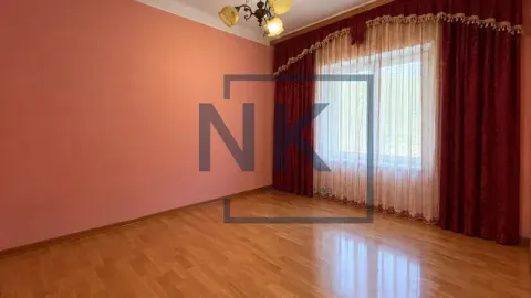 Empty room with pink walls, wooden parquet flooring, and dark red curtains. - image 7