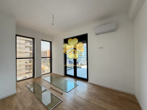 Empty room with hardwood floors, large windows, and an air conditioning unit. - image 12